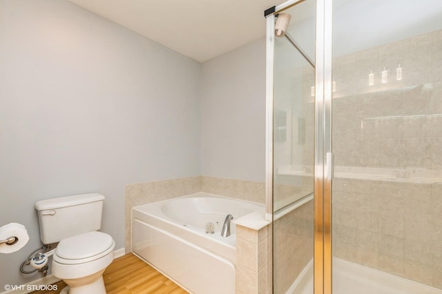 1040 Fairway Dr, Fox Lake, IL 60020 - full bath with a tub with jets, toilet, a stall shower, and wood finished floors