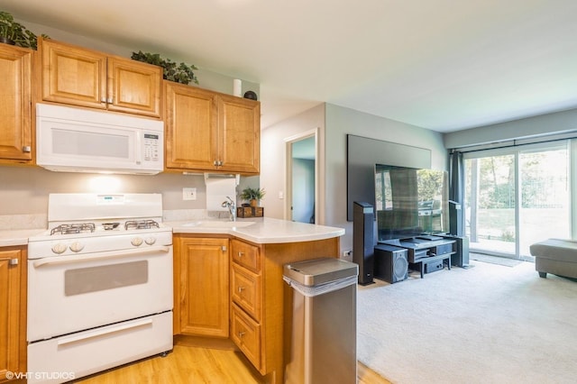 1040 Fairway Dr, Fox Lake, IL 60020 - kitchen with white appliances, a sink, a peninsula, and light countertops