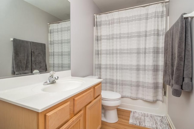 1040 Fairway Dr, Fox Lake, IL 60020 - bathroom featuring vanity, toilet, wood finished floors, and shower / bathtub combination with curtain