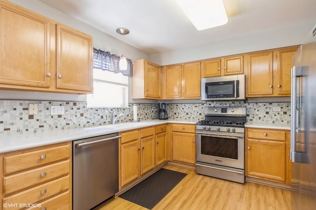 1040 Fairway Dr, Fox Lake, IL 60020 - kitchen featuring appliances with stainless steel finishes, light wood-type flooring, and light countertops