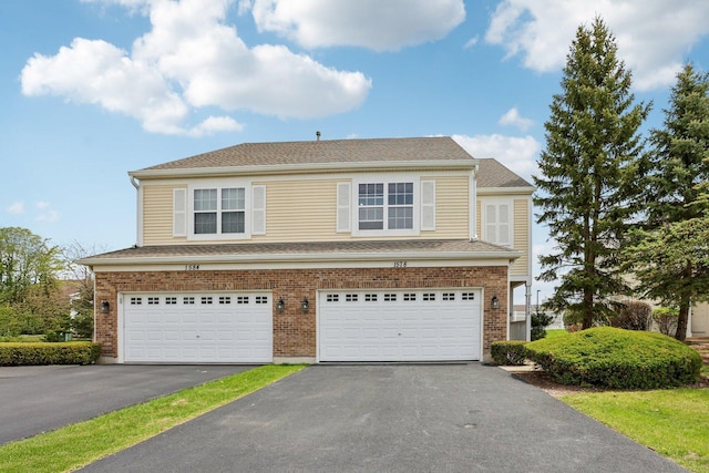 view of front of property featuring driveway and an attached garage