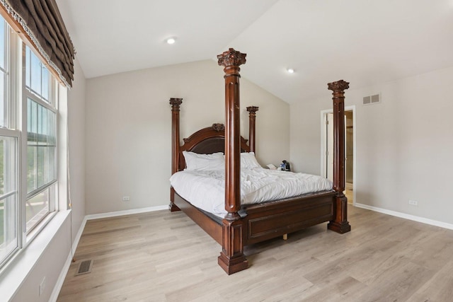 bedroom with light wood-style floors, lofted ceiling, baseboards, and recessed lighting
