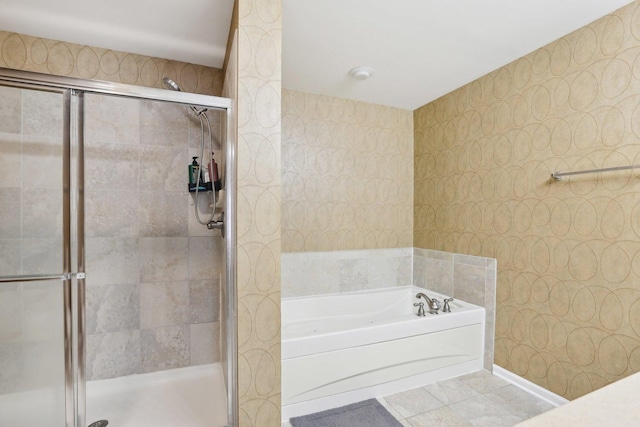 bathroom with a bath and a shower stall
