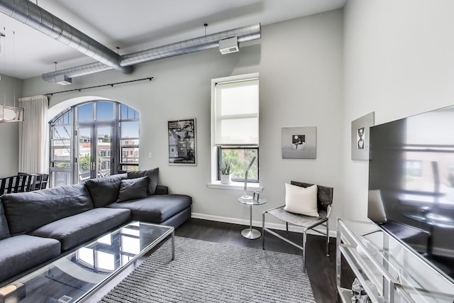 1201 W Wrightwood Ave Unit 22, Chicago, IL 60614 - living room featuring dark wood-type flooring and baseboards