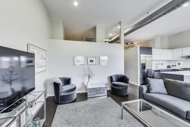 1201 W Wrightwood Ave Unit 22, Chicago, IL 60614 - living room featuring dark wood finished floors, recessed lighting, baseboards, and a high ceiling