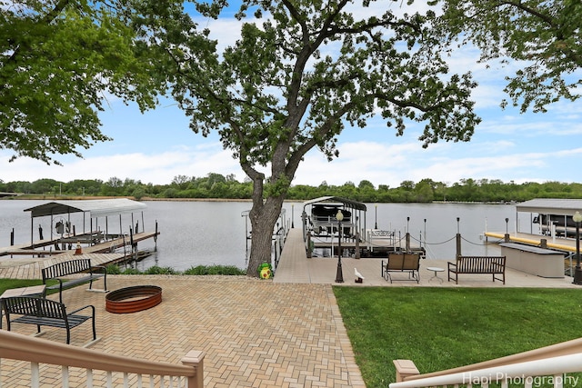209 S Emerald Dr, Mchenry, IL 60051 - dock featuring boat lift, a water view, and a lawn