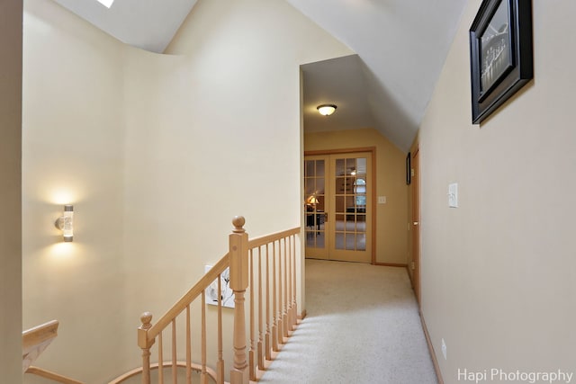 209 S Emerald Dr, Mchenry, IL 60051 - hall featuring an upstairs landing, vaulted ceiling, baseboards, french doors, and a skylight