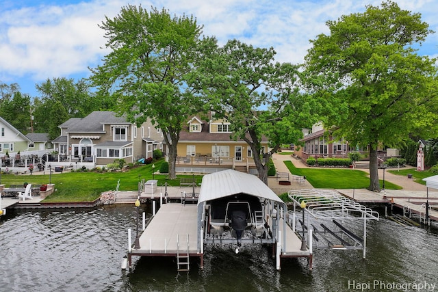 209 S Emerald Dr, Mchenry, IL 60051 - dock area featuring boat lift, a water view, and a lawn