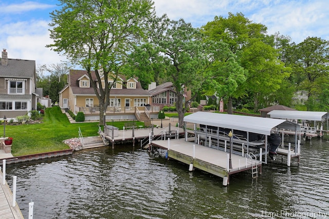209 S Emerald Dr, Mchenry, IL 60051 - dock area featuring boat lift, a water view, and a lawn