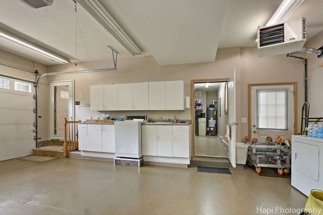 209 S Emerald Dr, Mchenry, IL 60051 - garage with washer / dryer, a heating unit, water heater, and a sink