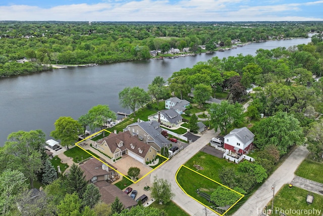 209 S Emerald Dr, Mchenry, IL 60051 - aerial perspective of suburban area with a nearby body of water, property boundaries highlighted, and a heavily wooded area