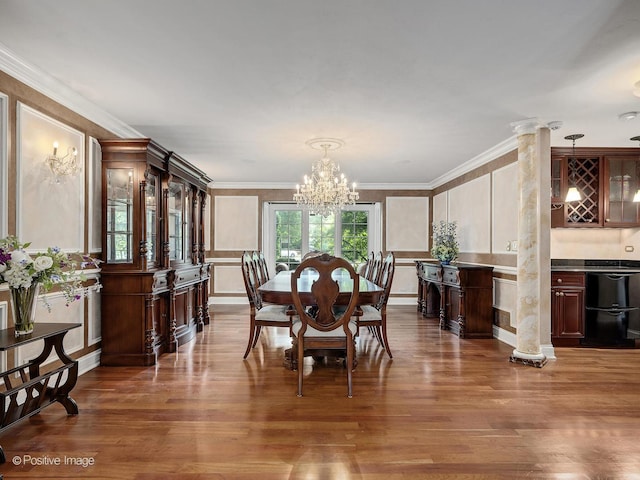 6 Swaps Ct, Oak Brook, IL 60523 - dining room featuring a decorative wall, a chandelier, wood finished floors, crown molding, and wainscoting