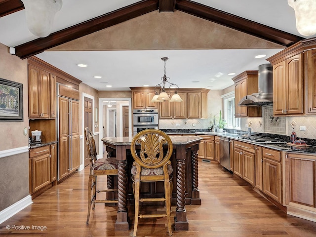 6 Swaps Ct, Oak Brook, IL 60523 - kitchen with wall chimney range hood, stainless steel appliances, a center island, light wood-type flooring, and a breakfast bar