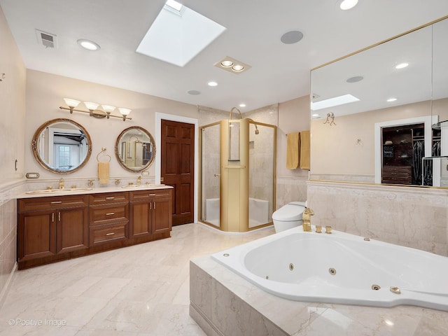 6 Swaps Ct, Oak Brook, IL 60523 - full bath with a skylight, a stall shower, a tub with jets, double vanity, and recessed lighting