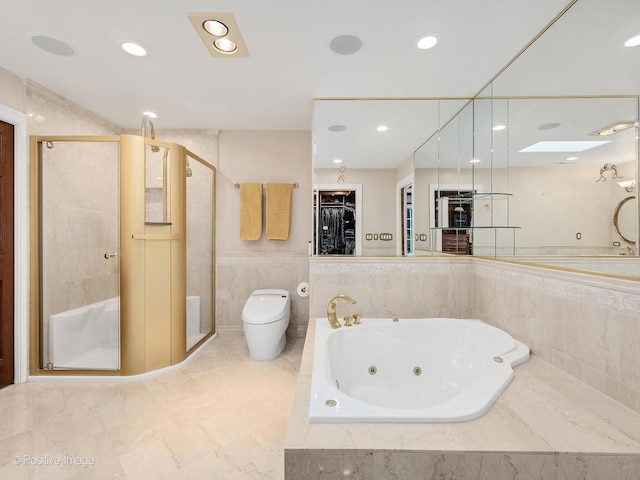 6 Swaps Ct, Oak Brook, IL 60523 - bathroom with a stall shower, a tub with jets, recessed lighting, a spacious closet, and a wainscoted wall