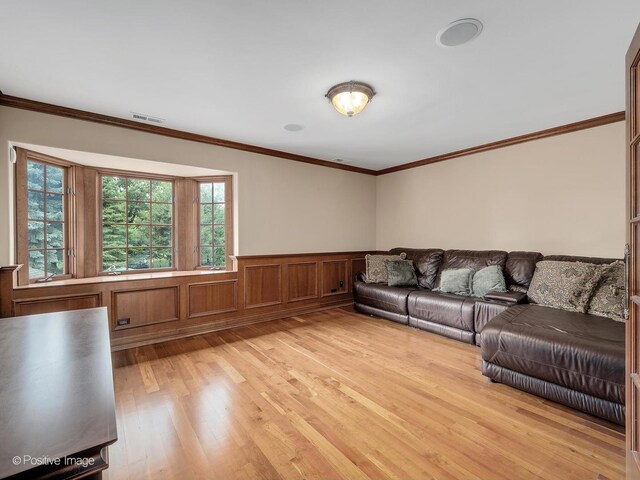 6 Swaps Ct, Oak Brook, IL 60523 - living area featuring light wood finished floors, wainscoting, and crown molding