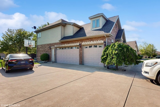 17040 Cheyenne Ct, Lockport, IL 60441 - view of home's exterior with brick siding, roof with shingles, concrete driveway, and an attached garage