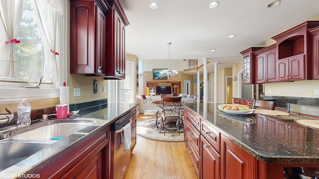 17040 Cheyenne Ct, Lockport, IL 60441 - kitchen with dark brown cabinets, dishwasher, light wood-type flooring, a sink, and open floor plan