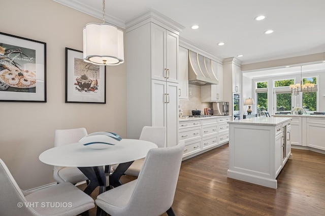 1559 S Paul Le Comte Ct, Palatine, IL 60067 - kitchen featuring ornamental molding, recessed lighting, custom exhaust hood, light countertops, and white cabinets