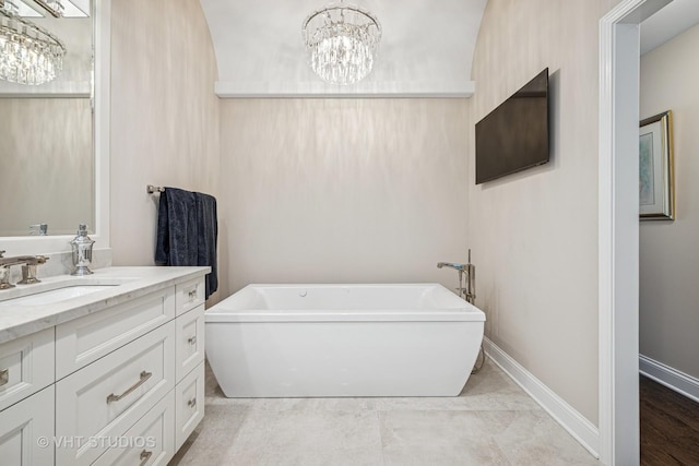 1559 S Paul Le Comte Ct, Palatine, IL 60067 - full bathroom with a freestanding bath, a chandelier, vanity, and baseboards