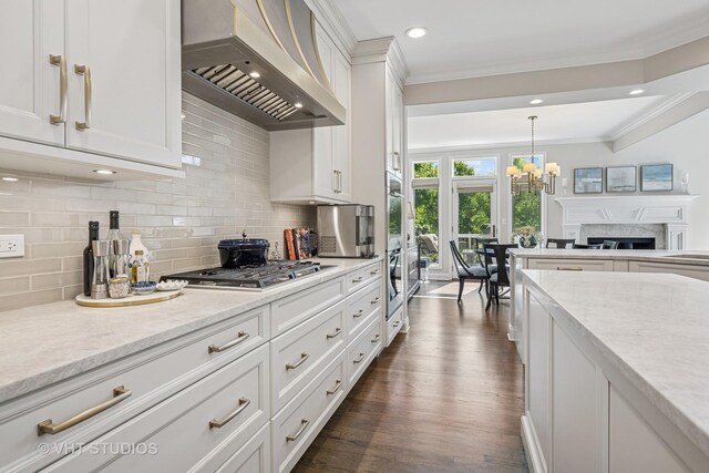 1559 S Paul Le Comte Ct, Palatine, IL 60067 - kitchen with custom exhaust hood, stainless steel appliances, backsplash, crown molding, and white cabinets