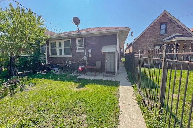 10817 S Forest Ave, Chicago, IL 60628 - rear view of property featuring a patio area and brick siding