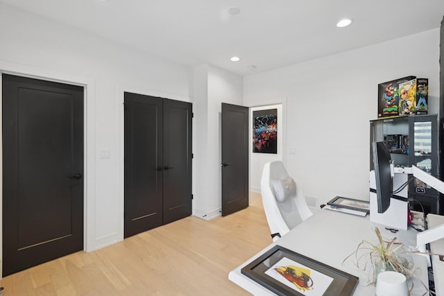 218 E 46th St, Chicago, IL 60653 - home office with light wood-style flooring and recessed lighting