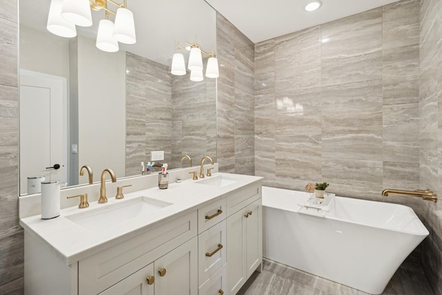 218 E 46th St, Chicago, IL 60653 - bathroom featuring tile walls, double vanity, and a freestanding bath