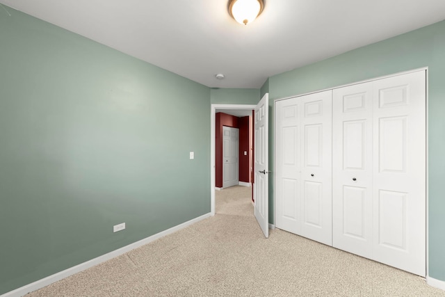 24608 George Washington Dr, Plainfield, IL 60544 - unfurnished bedroom with light carpet, baseboards, and a closet