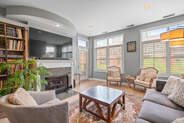 550 W Fulton St Unit 303, Chicago, IL 60661 - living area featuring wood finished floors, a premium fireplace, recessed lighting, and baseboards
