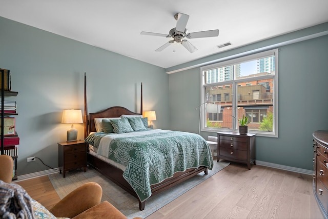 550 W Fulton St Unit 303, Chicago, IL 60661 - bedroom with light wood-type flooring, baseboards, and a ceiling fan
