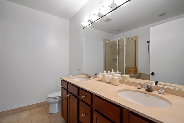 550 W Fulton St Unit 303, Chicago, IL 60661 - bathroom with toilet, a shower stall, double vanity, tile patterned flooring, and baseboards