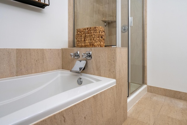 550 W Fulton St Unit 303, Chicago, IL 60661 - full bathroom featuring a shower stall, a garden tub, and tile patterned floors