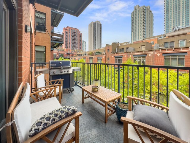 550 W Fulton St Unit 303, Chicago, IL 60661 - balcony with a view of city and a grill