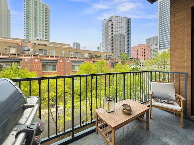 550 W Fulton St Unit 303, Chicago, IL 60661 - balcony with area for grilling and a view of city
