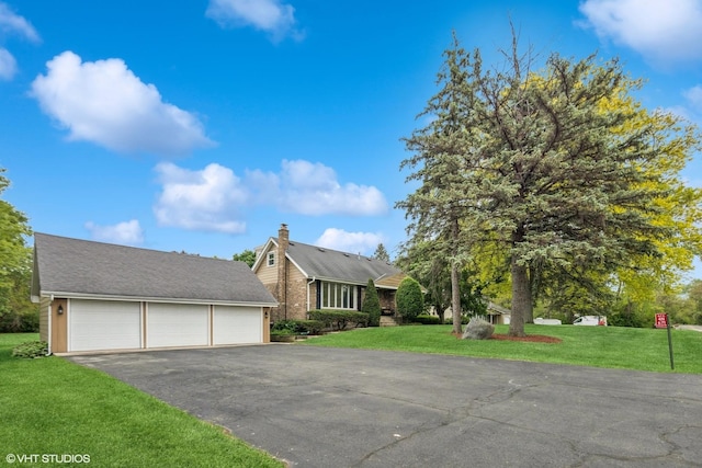 4N671 Petersdorf Rd, West Chicago, IL 60185 - view of front of property with a front yard and a garage