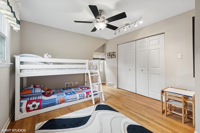 4N671 Petersdorf Rd, West Chicago, IL 60185 - bedroom with wood finished floors, a closet, baseboards, and ceiling fan
