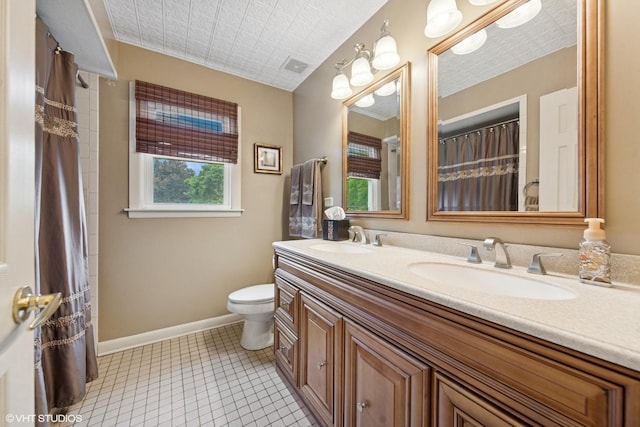 4N671 Petersdorf Rd, West Chicago, IL 60185 - bathroom featuring double vanity, toilet, baseboards, a shower with curtain, and tile patterned floors