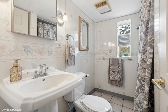 4N671 Petersdorf Rd, West Chicago, IL 60185 - bathroom featuring tile walls, toilet, tile patterned floors, a sink, and a shower with curtain