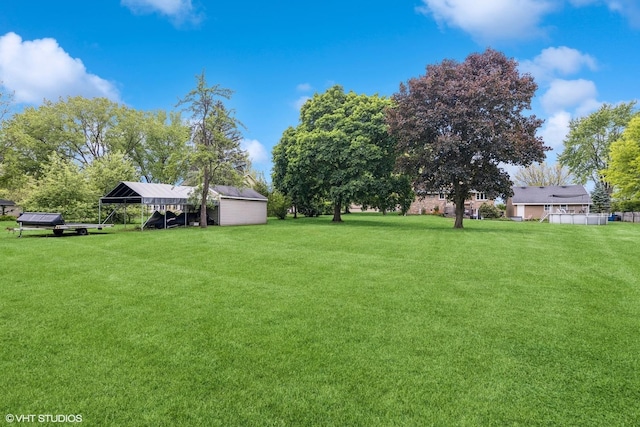 4N671 Petersdorf Rd, West Chicago, IL 60185 - view of green lawn featuring a carport