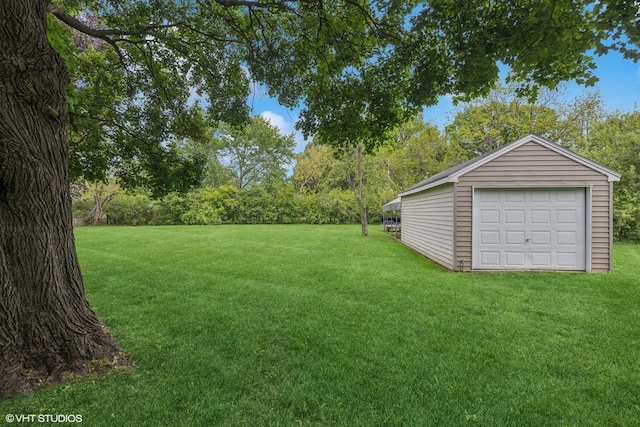 4N671 Petersdorf Rd, West Chicago, IL 60185 - view of grassy yard with an outdoor structure and a detached garage