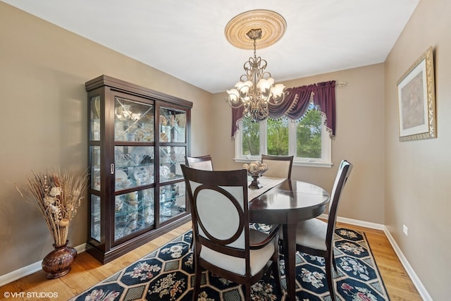 4N671 Petersdorf Rd, West Chicago, IL 60185 - dining space with a chandelier, light wood finished floors, and baseboards