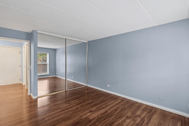 711 W Gordon Ter Unit 117, Chicago, IL 60613 - unfurnished bedroom with wood finished floors, baseboards, and a closet