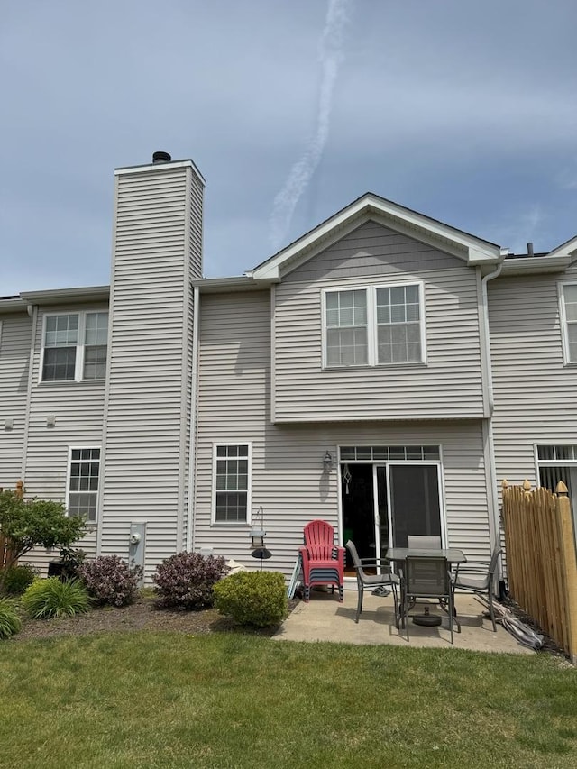 3854 Trading Post Ln, Joliet, IL 60435 - rear view of house with a patio and a chimney