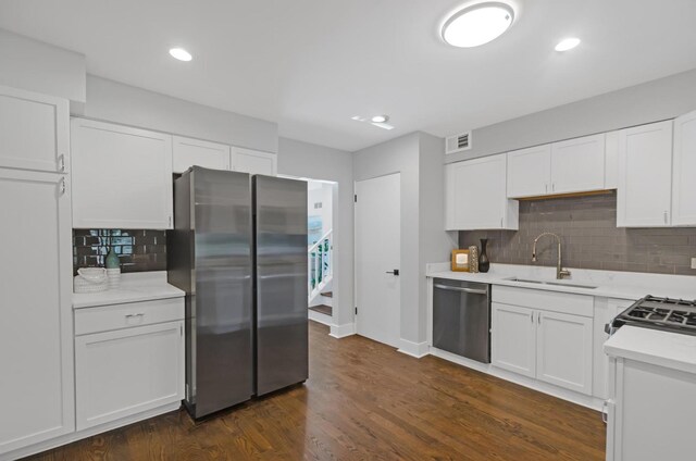 2200 W Crescent Ave, Park Ridge, IL 60068 - kitchen featuring stainless steel appliances, a sink, decorative backsplash, light countertops, and white cabinets