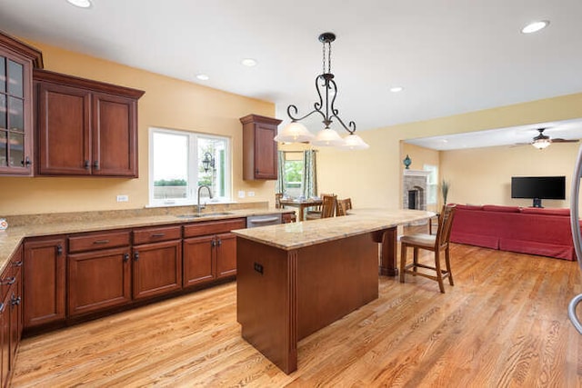 677 Slate Run, Elgin, IL 60124 - kitchen featuring a sink, light wood-style flooring, pendant lighting, a kitchen island, and recessed lighting