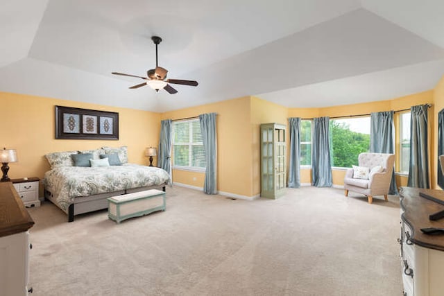 677 Slate Run, Elgin, IL 60124 - bedroom with light colored carpet, multiple windows, baseboards, vaulted ceiling, and ceiling fan
