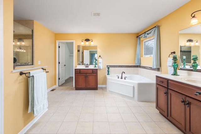 677 Slate Run, Elgin, IL 60124 - full bathroom with a garden tub, two vanities, and baseboards
