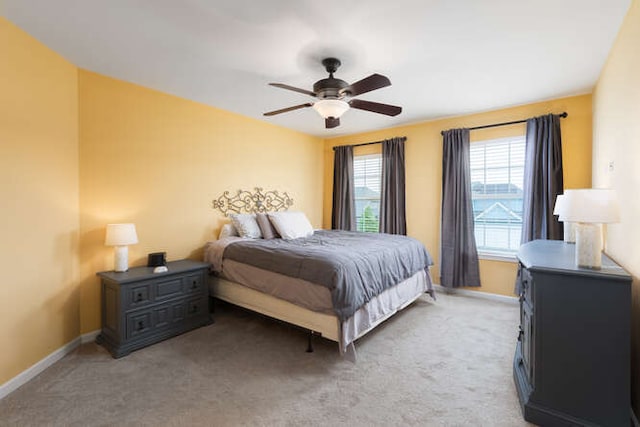 677 Slate Run, Elgin, IL 60124 - bedroom with baseboards, light carpet, and a ceiling fan