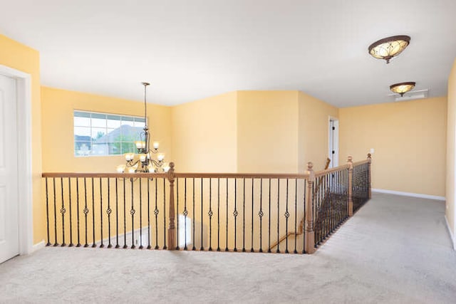677 Slate Run, Elgin, IL 60124 - corridor with carpet flooring, a chandelier, baseboards, and an upstairs landing